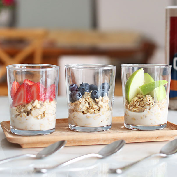 overnight oats 3 ways with sliced strawberries, blueberries, or apples